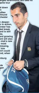  ??  ?? THE OLD KHIT BAG: United new boy Henrikh Mkhitaryan boards the plane to China