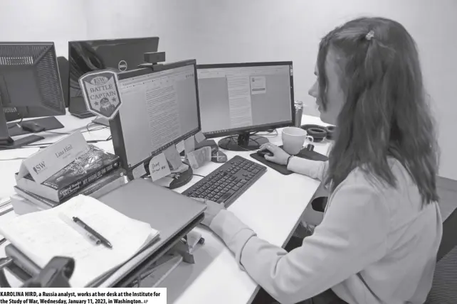  ?? AP ?? KAROLINA HIRD, a Russia analyst, works at her desk at the Institute for the Study of War, Wednesday, January 11, 2023, in Washington.