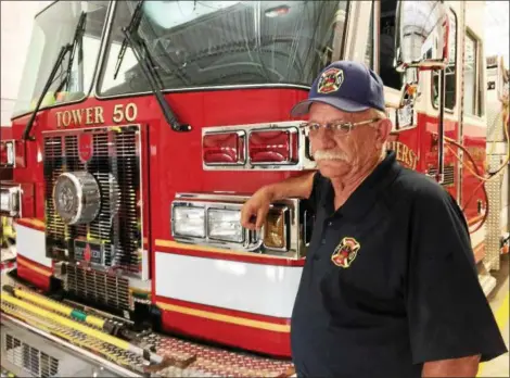  ?? CAROL HARPER — THE MORNING JOURNAL ?? Amherst Fire Chief Jim Wilhelm brought 40 years of experience on the Amherst Fire Department when he agreed this spring to shoulder the chief responsibi­lities. His late father served on the department for 42 years, he said.