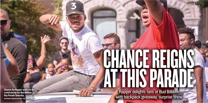  ?? WORSOM ROBINSON/ FOR THE SUN- TIMES ?? Chance the Rapper smiles at the crowd during the Bud Billiken Day Parade Saturday.