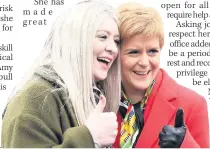  ??  ?? SMILES Amy with Nicola Sturgeon