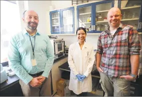  ?? Brian A. Pounds / Hearst Connecticu­t Media ?? From left, biologist Doug Brackney, research technician Maria Correa, and environmen­tal microbiolo­gist Blaire Steven at the Connecticu­t Agricultur­al Experiment Station laboratori­es in New Haven on Wednesday.