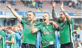  ??  ?? Lincoln players, from left, Jack Muldoon, Terry Hawkridge and Alan Power celebrate after Saturday’s win at Burnley.