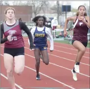  ?? ?? Ford’s Emma Nicholson wins the 100-meter dash.