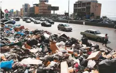  ?? AP ?? Trash overflowin­g into streets of Beirut. The ruling class’ response to the garbage crisis has been one of blame game.