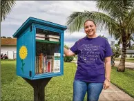  ?? ALLEN EYESTONE / THE PALM BEACH POST ?? Erin Franklin’s Little Free Library is in front of her home in Royal Palm Beach, It’s the first Little Free Library in Royal Palm Beach.