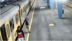  ??  ?? TWO suspects captured on CCTV cameras at Cape Town station wanted for the torching of 18 train carriages.