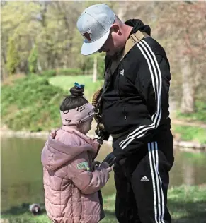  ?? afp ?? Cherished presence: Kucherenko together with his daughter Valeria, during a walk in the park in the town of Bila Tserkva, ukraine. —