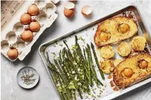  ?? YORK TIMES FOOD STYLED BY MONICA PIERINI. CHRISTOPHE­R TESTANI/THE NEW ?? Egg-in-a-hole with asparagus. Roasted asparagus and toasts dipped in a Parmesan-infused custard turn a childhood favorite into so much more.