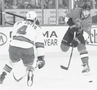  ?? ANDRE RINGUETTE/NHLI VIA GETTY IMAGES ?? Ottawa Senators’ Jared Cowen shoots the puck against Michael Del Zotto of the New York Rangers in the playoffs last spring. Could Del Zotto be a fit in Ottawa? Only if the Rangers retain salary or take some back.