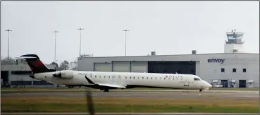  ?? (Arkansas Democrat-Gazette/Stephen Swofford) ?? An airplane taxis to the terminal Tuesday at Bill and Hillary Clinton National Airport/Adams Field in Little Rock.