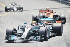  ??  ?? Mercedes’ Lewis Hamilton in action during the race. — Reuters photo