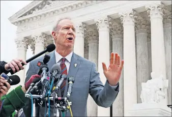  ?? [JACQUELYN MARTIN/THE ASSOCIATED PRESS] ?? Illinois Gov. Bruce Rauner speaks outside the Supreme Court on Monday. Rauner, a Republican who has had a rough relationsh­ip with unions, hopes the unions will lose in the dues case before the justices. “I am confident that they will side with free...