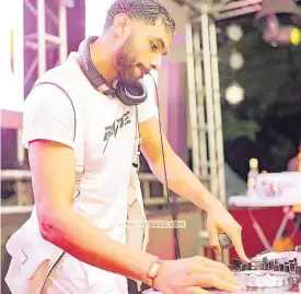  ?? CONTRIBUTE­D ?? DJ Fade is fully focused as he cues up musical selections at Dream Weekend event Celebrity Playground last Friday.