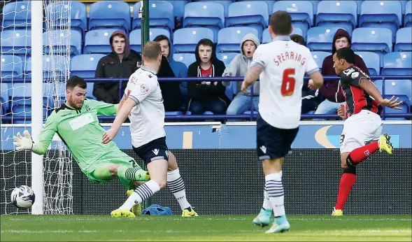  ?? PICTURES: Action Images ?? DOUBLE TROUBLE: Bournemout­h’s Callum Wilson scores his second to sink Bolton