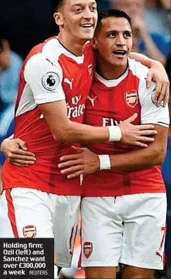  ?? REUTERS ?? Holding firm: Ozil (left) and Sanchez want over £300,000 a week