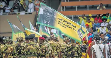  ?? Picture: AFP ?? An Umkhonto weSizwe veteran holds a flag bearing a portrait of former ANC president Jacob Zuma during the ANC’s 106th anniversar­y celebratio­n in East London yesterday.