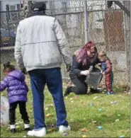  ??  ?? Children flooded Troy Central Little League field Saturday for an Easter Egg Hunt.