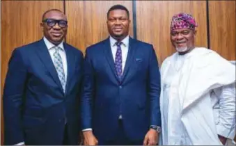  ?? ?? L-R: Chairman of Board, Samuel Egube; Chief Executive Officer,Simon Adozi, and Chairman of the Governance and Strategy Committee, Lekan Ogunbanwo at the boarding meeting of Adozillion Homes and Realty in Lagos...recently