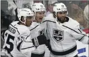  ?? JIM MONE — THE ASSOCIATED PRESS ?? The Kings' Gabriel Vilardi, center, celebrates his goal with teammates is Quinton Byfield, left, and Alex Iafallo.