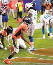  ?? Matthew Stockman Getty Images ?? KJ HAMLER of the Broncos celebrates his gamewinnin­g touchdown catch against the Chargers.