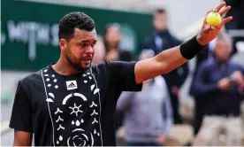  ?? ?? Jo-Wilfried Tsonga, hampered by a shoulder injury, tears up towards the end of his defeat to Casper Ruud. Photograph: Shi Tang/Getty Images