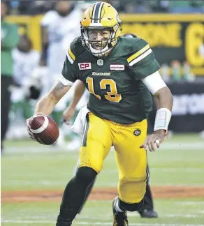  ?? ED KAISER ?? Edmonton Eskimos QB Mike Reilly put up some impressive numbers against the Tiger Cats, but the defence collapsed in the second half and Hamilton surged back to win.