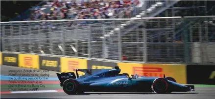  ?? — AFP ?? Mercedes’ British driver Lewis Hamilton steers his car during the qualifying session for the Formula One Azerbaijan Grand Prix at the Baku City Circuit in Baku.