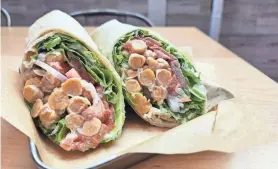  ?? COURTESY OF GRAY LEAF VEGAN ?? A chickpea wrap with housemade Caesar dressing, lettuce, tomato and red onion at Gray Leaf Cafe in Freehold Township.