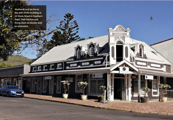  ??  ?? Mynhardt and Ian live in the attic of this building at 24 Stasie Street in Southern Paarl. Their kitchen and living room do double duty as restaurant.