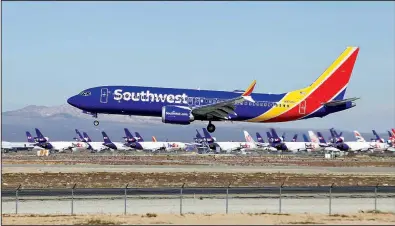  ?? AP/MATT HARTMAN ?? A Southwest Airlines Boeing 737 Max aircraft lands at the Southern California Logistics Airport in the high desert town of Victorvill­e, Calif., earlier this year.