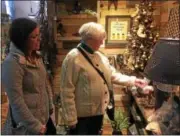  ?? GLENN GRIFFITH — GGRIFFITH@DIGITALFIR­STMEDIA.COM ?? Casey Flaherty, left, and Sheila Ogden look at some of the many items in the Olde Mercantile in Cohoes on Saturday.