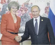  ??  ?? 0 Top, Theresa May takes her place among the G20 leaders at a group photocall. Above from left,she met with Vladimir Putin, Saudi Arabia’s Deputy Crown Prince Mohammed bin Salman, left, US Barack Obama and China’s Xi Jinping