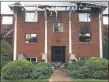  ?? EVAN BRANDT — MEDIANEWS GROUP ?? The front entrance of the Ashwood Apartment building was a burnt-out shell the day after flames destroyed the complex.