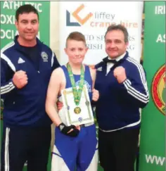  ??  ?? Enniskerry’s Cole Byrne with his Leinster title along with coaches Ben Lynch and Paul O’Toole