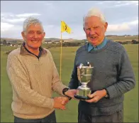  ??  ?? Last year’s winner Bill Brannigan, left, presents Sandy Watson with the Heidbanger­s Cup.