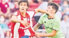  ?? — AFP photo ?? Felix (left) fouls Athletic Bilbao’s Spanish midfielder Unai Vencedor during the Spanish League football match between Club Atletico de Madrid and Athletic Club Bilbao at the Wanda Metropolit­ano stadium.