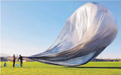  ?? PHOTO COURTESY OF RASPBERRY SHAKE ?? The four-story “Jon Magnus” solar-powered hot air balloon gets ready for launch at Balloon Fiesta Park on Wednesday.