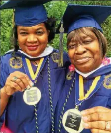  ?? KATHLEEN E. CAREY — DIGITAL FIRST MEDIA ?? Diane Watson, 65, and Geneva Alvin, 64, both of Chester, show the medals they received for graduating with honors in the liberal arts program at Neumann University Saturday.