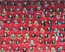  ?? MARLA BROSE/JOURNAL ?? University of New Mexico graduates fill The Pit during the 2015 commenceme­nt ceremony for undergradu­ates.