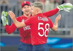  ?? ?? Sam Curran celebrates with England skipper Jos Buttler in Perth