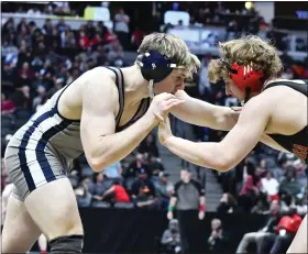  ?? PHOTOS BY ALISSA NOE — BOCOPREPS.COM ?? Legacy’s Quinn Funk, left, secured his spot in the Class 5A state title match with a 10-6 win over Ponderosa’s Westin Hoffschnei­der during the state semifinals at Ball Arena.