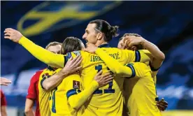  ??  ?? Zlatan Ibrahimovi­c celebrates Viktor Claesson’s goal with his teammates after returning to the side after almost five years to become Sweden’s oldest ever player. Photograph: Michael Campanella/Getty Images