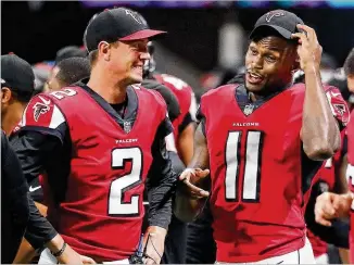  ?? CURTIS COMPTON / CCOMPTON@AJC.COM ?? Falcons quarterbac­k Matt Ryan (with wide receiver Julio Jones (11) during last week’s final exhibition game) is 5-4 in regular-season openers, 1-1 under coach Dan Quinn.