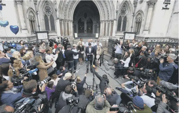  ?? PICTURE: GETTY IMAGES ?? Charlie’s father Chris Gard reads out a statement while his mother Connie Yates looks on outside the Royal Courts of Justice in London