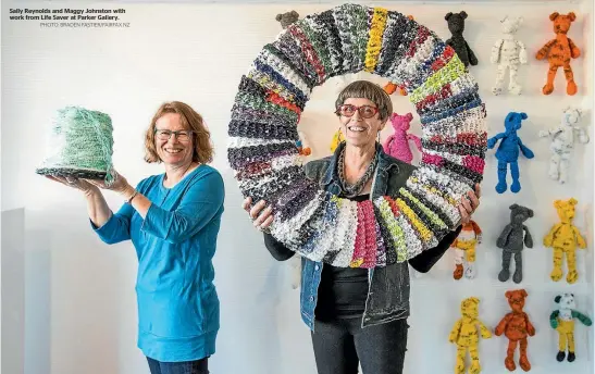  ?? PHOTO: BRADEN FASTIER/FAIRFAX NZ ?? Sally Reynolds and Maggy Johnston with work from Life Saver at Parker Gallery.