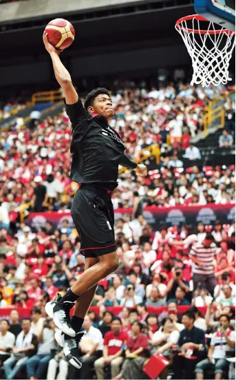  ??  ?? Japan’s Rui Hachimura warming up before a basketball match between Japan and Germany at Saitama Super Arena in Tokyo. — AFP