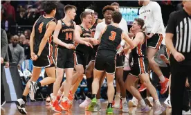  ?? Photograph: Kyle Terada/USA Today Sports ?? Princeton Tigers celebrate their upset victory over Arizona at the NCAA Tournament.