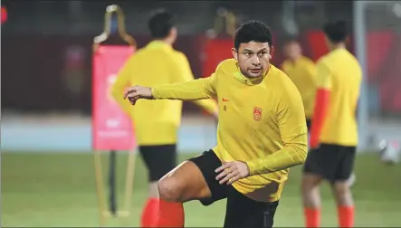  ?? XINHUA ?? Forward Ai Kesen trains with Team China in Tianjin ahead of Tuesday’s crucial World Cup qualifier against Singapore. Team China is in desperate need of a home victory after drawing the correspond­ing fixture in Singapore last Thursday.