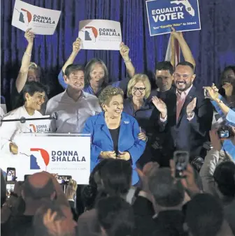  ?? AP ?? 2020 SEASON: Democratic candidate Donna Shalala, center, celebrates her victory yesterday over Republican Maria Elvira Salazar in Coral Gables, Fla.